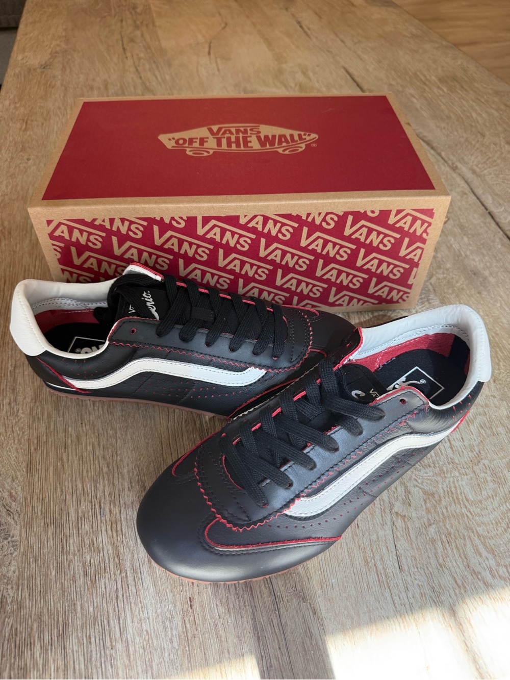 Vans Black Sneakers with White Stripe and Red Stitching
